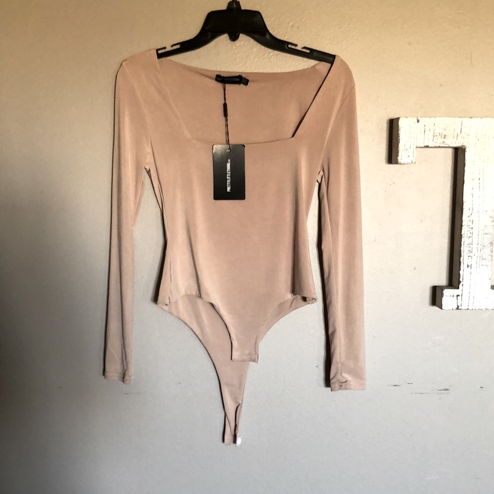 Long sleeved cream bodysuit